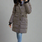 Mid-length vegan down winter coat for women with detachable fur hood, cargo pockets, and thumb hole cuffs.