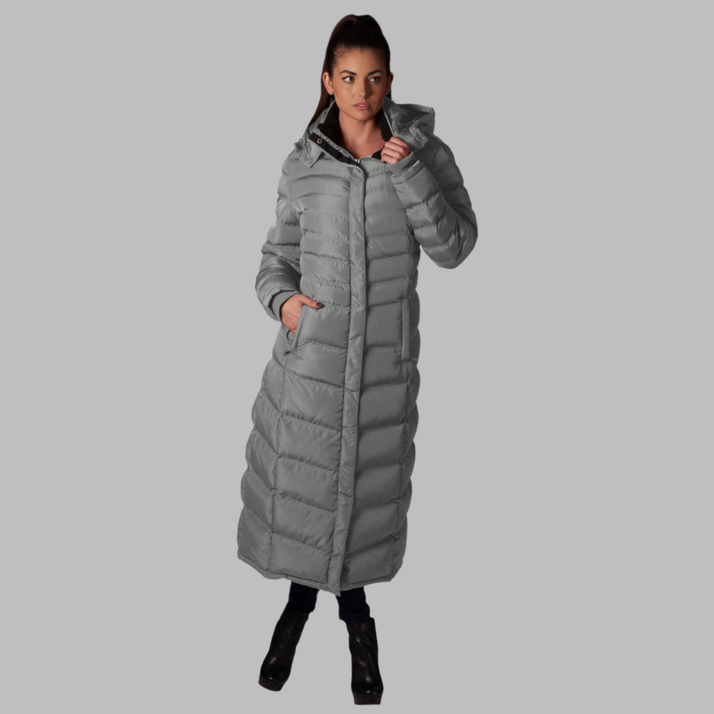 Women's stylish full-length puffer coat for winter, featuring a hood and sleek design.